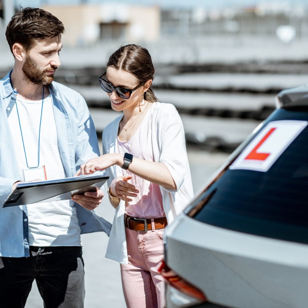 instructor-with-female-student-at-the-driving-school-outdooors-1.jpg